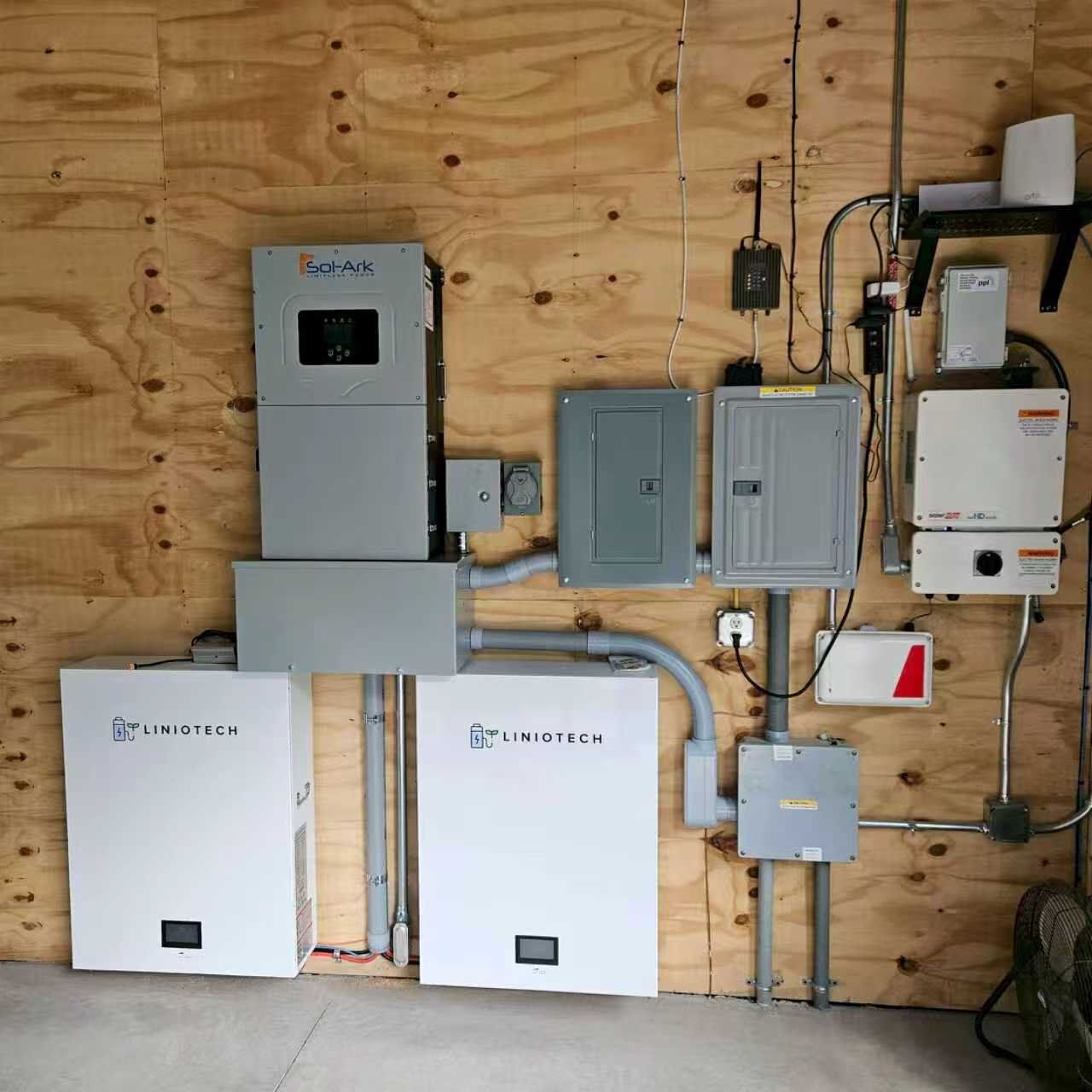 Two wall-mounted Liniotech batteries installed with a Sol-Ark hybrid inverter Two wall-mounted Liniotech batteries installed with a Sol-Ark hybrid inverter