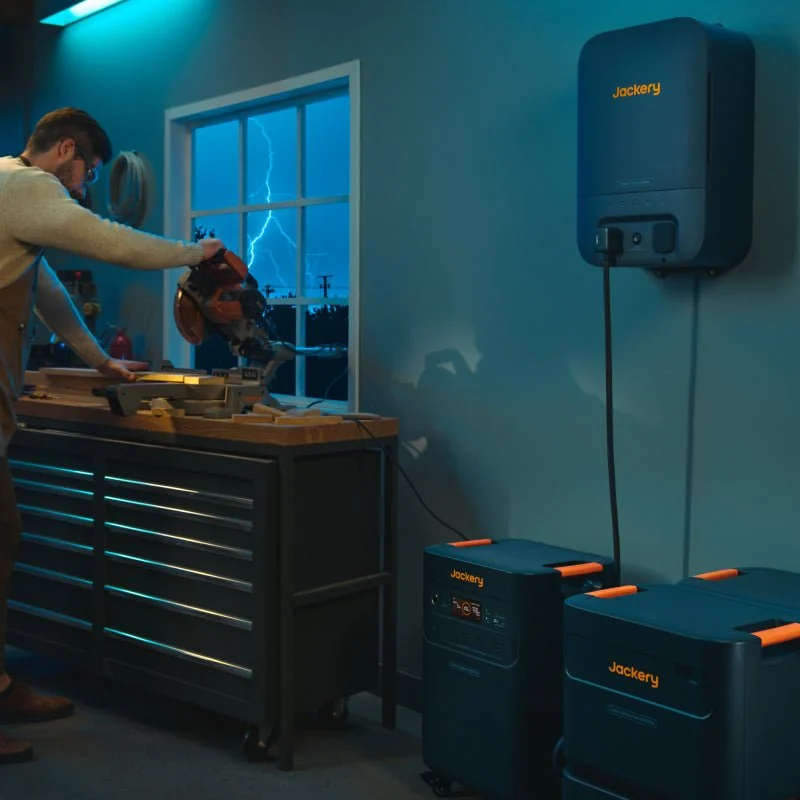 Jackery Battery Pack 5000 Plus – garage setup with Explorer 5000 Plus Jackery Battery Pack 5000 Plus expansion batteries stacked with an Explorer 5000 Plus in a garage (station sold separately)